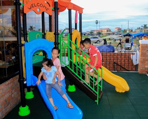 Children playing at the opening of the Pizza Company in Kampong Cham Town